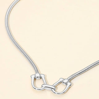 Stainless Steel Linked Horsebit Pendant Necklace: Rhodium